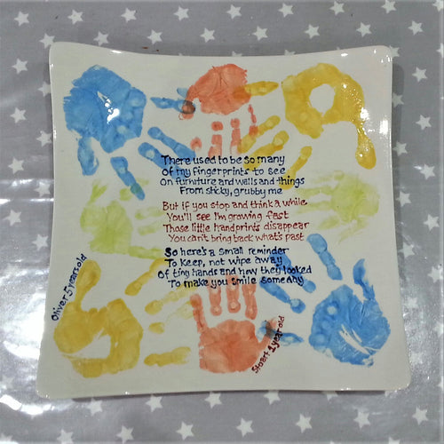 Large Square Platter with family hand prints in blue, orange, yellow and green with a poem written in the middle.