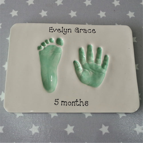 Rectangle Clay Imprint with foot and hand print in mint green.  Unframed. 