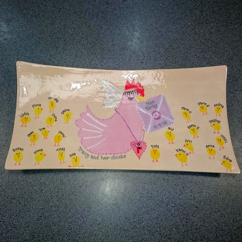 A Hen Party rectangular keepsake platter with guests finger prints as eggs and a painted bird as the bride.