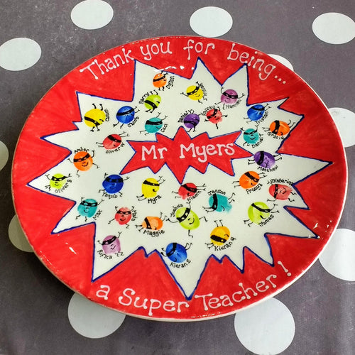 Teacher's thank you plate with fingerprints of the class turned into mini superheroes.