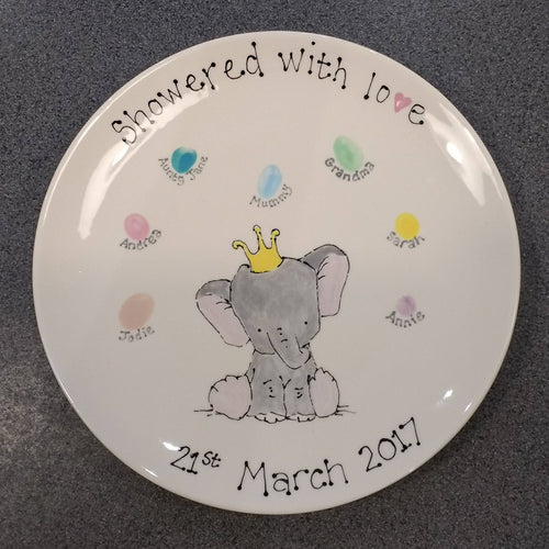 Baby shower keepsake plate with cute baby elephant painted after baby shower guests painted fingerprints were added.