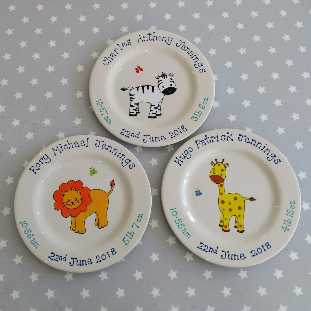 Baby keepsake plates with cute animals and details of baby's name, date of birth, time of birth and weight.