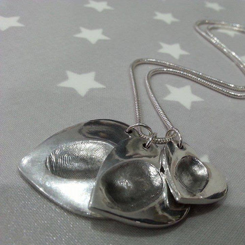 Love Prints fingerprint hearts in small, medium and large on sterling silver snake chain.