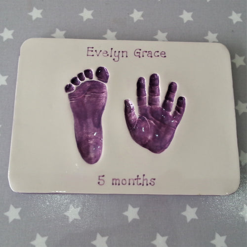 Rectangle Clay Imprint with foot and hand print in purple.  Unframed.