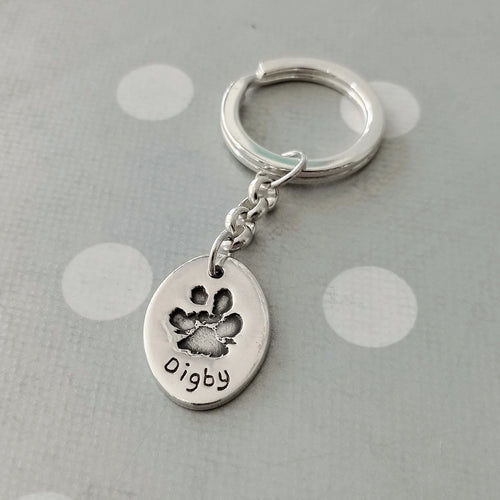 Love Prints large oval charm with paw print on sterling silver key chain and keyring. 