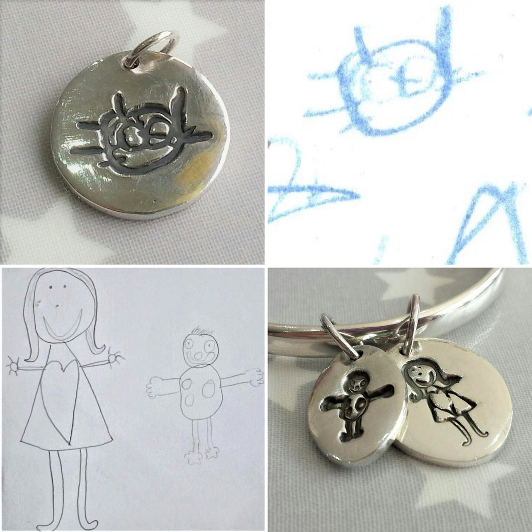 Love Prints charms with children's drawings of a cat and little people.