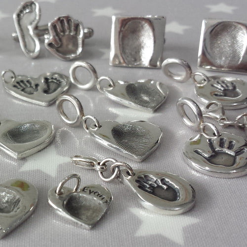 Love Prints charms.  A selection of hand, foot and fingerprint charms and cufflinks.