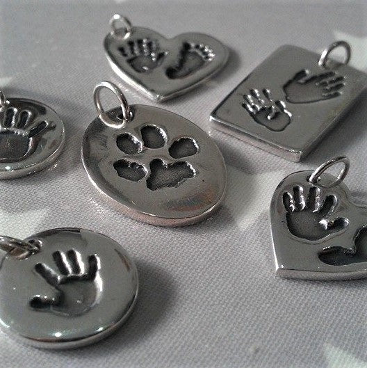 Love Prints hand, foot and pawprint charms.  Heart, rectangle, circle and oval shaped. 
