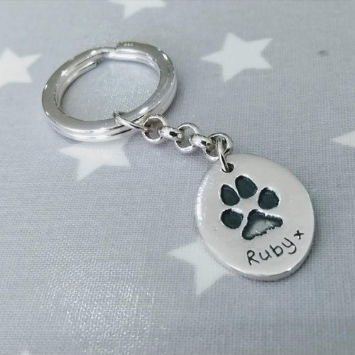 Love Prints large oval charm with paw print on sterling silver key chain and keyring.