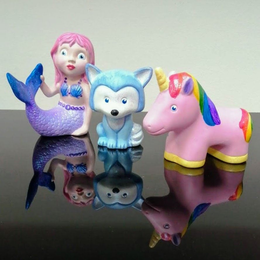 Pottery with Acrylics.  Brightly painted mermaid, fox and unicorn.